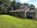 Spacious backyard with well-maintained lawn and a view of the home's exterior at 227 James Rd, Taylorsville, NC 28681