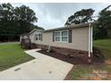Single-story home featuring a paved walkway and well-maintained lawn at 2418 6Th Sw Ave, Hickory, NC 28602