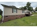 View of single-story house with brick foundation and vinyl siding at 2418 6Th Sw Ave, Hickory, NC 28602
