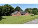 Expansive lawn surrounds this brick home, offering a serene and private setting at 2765 Dogwood Cir, Rock Hill, SC 29732