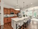 Spacious kitchen features a large center island with marble countertop and pendant lighting at 3036 Luke Crossing Dr, Charlotte, NC 28226