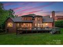 Expansive back exterior with large patio perfect for entertaining with a lawn and lots of space at 408 Covington Xing, Matthews, NC 28104
