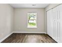Clean bedroom with laminate flooring and natural light from a large window at 429 Merry Go Dr, York, SC 29745