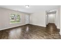 Inviting living room featuring laminate flooring and a bright front window at 429 Merry Go Dr, York, SC 29745