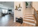 Welcoming foyer features wood floors, staircase and an open view of the living spaces at 5391 Orchid Bloom Dr, Indian Land, SC 29707
