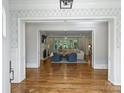 Bright living room with fireplace, hardwood floors, modern decor, and lots of windows at 6314 Saint Stephen Ln, Charlotte, NC 28210