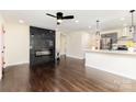 Stylish living room with fireplace, open to kitchen, with sleek hardwood floors and modern lighting at 803 Irene Ave, Kannapolis, NC 28083