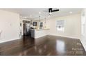 Bright and airy living room with hardwood floors seamlessly flows into a modern kitchen at 803 Irene Ave, Kannapolis, NC 28083