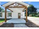Inviting front porch with sturdy timber posts and beams, offering a warm welcome to this cozy home at 1122 Oconee Ave, Rock Hill, SC 29732