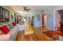 Open living space with hardwood floors and a modern ceiling fan at 1226 Rising Oak Dr, Charlotte, NC 28206