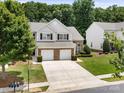 Aerial view of a two-story townhome with a two-car garage and manicured landscaping at 12415 Stratfield Place Cir, Pineville, NC 28134