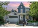 Charming two-story home with a covered porch, a two-car garage, and a beautifully landscaped front yard at 138 Blandina Ct, Fort Mill, SC 29708