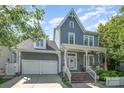 Charming two-story home with a covered porch, a two-car garage, and a beautifully landscaped front yard at 138 Blandina Ct, Fort Mill, SC 29708