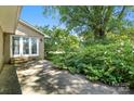 A tranquil patio space surrounded by verdant greenery, perfect for outdoor relaxation and entertaining at 13909 Idlewild Rd, Matthews, NC 28105
