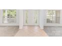 Bright foyer featuring tile flooring, decorative door windows, and ample natural light, creating a welcoming entrance at 14333 Maclauren Ln, Huntersville, NC 28078