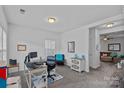 Bright and spacious office features a desk, comfortable chair, and plenty of natural light at 1527 Scarbrough Sw Cir, Concord, NC 28025