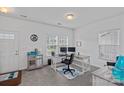 Bright office with large windows, desk, chair, and ample workspace at 1527 Scarbrough Sw Cir, Concord, NC 28025