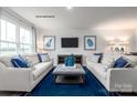 Cozy living room featuring two sofas, blue accents, and lots of natural light at 177 Basildon St # 1014, Lancaster, SC 29720