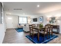 Open concept living space featuring dining area, living room, and view to the front door at 177 Basildon St # 1014, Lancaster, SC 29720