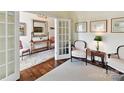 Cozy office space featuring French doors and a view of the foyer at 19205 Hidden Cove Ln, Cornelius, NC 28031