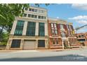 A sophisticated exterior showcasing the building's architectural design and urban setting at 229 N Church St # 401, Charlotte, NC 28202