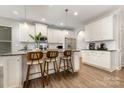 Bright kitchen featuring white cabinets, granite countertops, and stainless steel appliances at 3332 Katherine Taylor Ct, Monroe, NC 28110