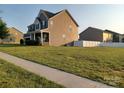 Charming two-story home with a well-manicured lawn at 3717 English Garden Dr, Gastonia, NC 28056