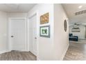 Bright hallway featuring wood floors and access to the living space at 4227 Mackinnon Dr, Charlotte, NC 28214