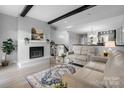 Cozy living room with fireplace, modern decor, and seamless access to the dining area at 5192 Corbin Ln, Hickory, NC 28601