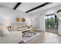 Bright living room with hardwood floors, decorative fireplace, and sliding glass doors to a outdoor area at 5192 Corbin Ln, Hickory, NC 28601