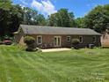 Spacious backyard featuring a patio and lush lawn perfect for outdoor activities at 5238 Bethel Church Rd, Hickory, NC 28602