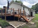 Spacious wooden deck with black metal railing and steps, perfect for outdoor relaxation at 618 Springfield Nw Dr, Concord, NC 28027