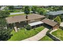 Back aerial view featuring a covered parking area, detached garage and ample yard space at 900 Nance St, Kannapolis, NC 28083