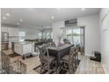 Bright dining area with modern table set and sliding glass door to outdoor space at 1010 Harry Ct, Albemarle, NC 28001