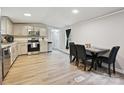 Well-lit kitchen featuring stainless steel appliances and hardwood floors at 1140 Randall Ct, Concord, NC 28025