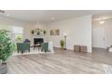 Bright living room featuring a cozy fireplace and modern hardwood floors at 1514 Starmount Cove Ln, Charlotte, NC 28210