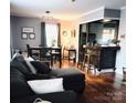 Inviting living room featuring hardwood floors, open layout, and breakfast bar at 1617 Madison St, Rock Hill, SC 29732