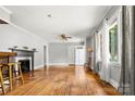 Spacious living room with hardwood floors, fireplace, and natural light from large windows at 1617 Madison St, Rock Hill, SC 29732