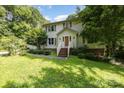 Charming two-story home with white siding, brick accents, and a well-maintained front lawn at 204 S Deerfield Cir, Salisbury, NC 28147