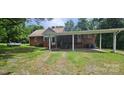 Expansive backyard featuring lush greenery, a car port, and convenient access at 2828 Bellhaven Cir, Charlotte, NC 28214