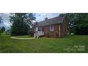 Quaint brick home boasting a tidy lawn and an inviting front entrance at 2828 Bellhaven Cir, Charlotte, NC 28214