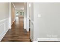 Inviting hallway with hardwood floors leading to a bright and open living space at 3029 Marchers Trace Dr, Charlotte, NC 28227