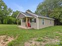 Quaint single-story house featuring a covered porch and a well-maintained lawn at 313 S Park Dr, Wadesboro, NC 28170