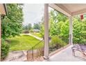 View from front porch showcasing mature trees and landscaping at 3874 Willow Grove Ln, Concord, NC 28025