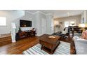 Open-concept living area featuring hardwood floors, modern decor, and seamless flow to the kitchen and dining spaces at 432 W Worthington Ave, Charlotte, NC 28203