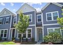 Charming townhome with a neat lawn and light blue exterior at 517 Morrows Turnout Way, Pineville, NC 28134