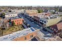 Aerial view shows city's charming buildings, street parking and vibrant shops with the backdrop of a clear blue sky at 531 Winding Way # 9, Belmont, NC 28012