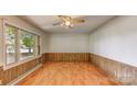 Bright room with laminate floors, wood paneling and natural light at 617 Oak Grove Rd, Kings Mountain, NC 28086