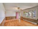 Spacious living room with wood paneling, laminate floors and large window at 617 Oak Grove Rd, Kings Mountain, NC 28086