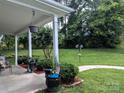 Covered front porch adorned with plants and greenery, creating a welcoming entrance at 725 Chelton Ln, Fort Mill, SC 29715